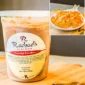 A container of Rachael’s Crawfish Etouffee next to an inset photo of the recipe in a white bowl.