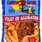 A 1 lb package of alligator meat, featuring an image of fried pieces and a seasoned fillet on a plate.