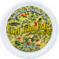 Chef John Folse spinach and artichoke dip in a round container, featuring red pepper pieces and branding.