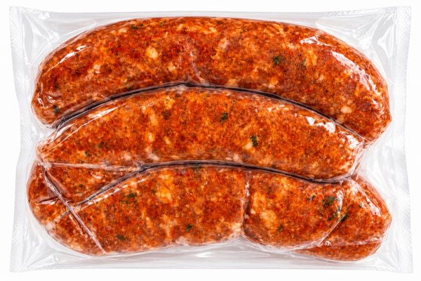 comeauxs alligator boudin back Three raw, seasoned Comeaux’s Alligator Boudin sausage links in a clear plastic package.