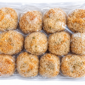 A vacuum-sealed plastic package containing twelve Comeaux’s alligator boudin balls.