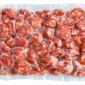 A 5 lb vacuum-sealed bag of sliced Comeaux’s Smoked Andouille Sausage rounds.