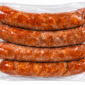 A vacuum-sealed package containing four links of Comeaux’s chicken smoked andouille sausage.