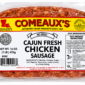 A vacuum-sealed package containing four links of raw, seasoned Comeaux’s Fresh Chicken Sausage.