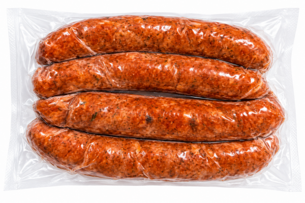 comeauxs jalapeno smoked sausage back Four vacuum-sealed links of Comeaux’s Smoked Jalapeno Sausage with visible spice flecks.