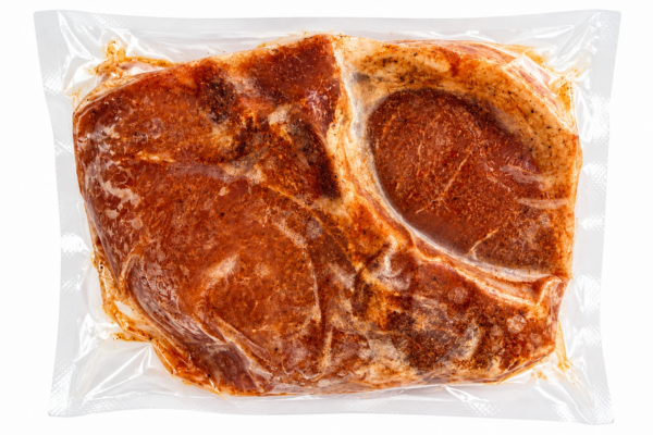 comeauxs pork chops back Vacuum-sealed package of Comeaux’s seasoned crawfish boudin stuffed pork chops.