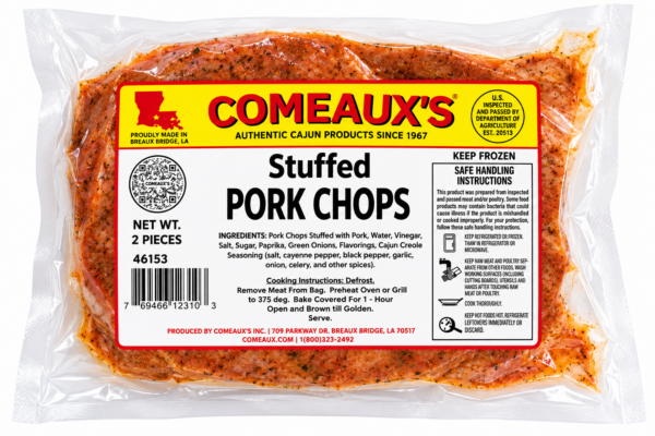 Seasoned Comeaux’s pork sausage stuffed pork chops in clear, vacuum-sealed packaging.