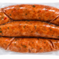 Three links of Comeaux’s Seafood Boudin in a vacuum-sealed plastic package.