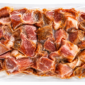 A 1 lb vacuum-sealed package of cubed, seasoned Comeaux’s Tasso Ham.