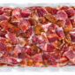 A 4lb vacuum-sealed bag of Comeaux’s Tasso Ham filled with cubes of seasoned, raw meat.