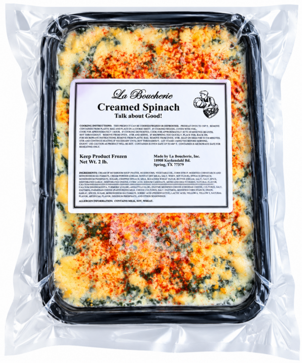 la boucherie creamed spinach front A La Boucherie 2 lb creamed spinach side dish in a sealed plastic tray, topped with melted cheese and red spices.