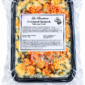 A La Boucherie 2 lb creamed spinach side dish in a sealed plastic tray, topped with melted cheese and red spices.