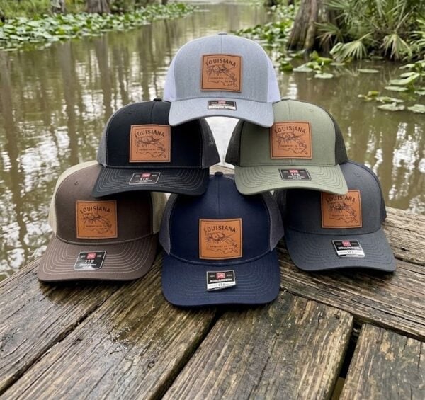 logo leather patch Six multi-colored LA Crawfish Co. hats, each featuring a leather patch with a crawfish logo.