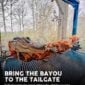 A whole skinned Louisiana alligator roasting on a rotisserie grill.