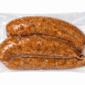 Three vacuum-sealed links of The Best Stop Mild Boudin.
