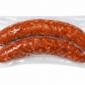 Two links of The Best Stop smoked pork sausage, vacuum-sealed in a clear plastic package.