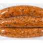 Three links of The Best Stop Crawfish Boudin vacuum-sealed in clear plastic.