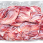 Two raw, 2lb bone-in alligator legs, non-marinated and sealed in a clear vacuum-packed plastic bag.