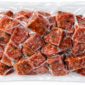 A one-pound vacuum-sealed package of cubed, seasoned Bougie Bologna Bites.