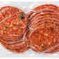 Two stacks of thinly sliced, 1 lb Bougie Bologna Jalapeno in clear vacuum-sealed packaging.