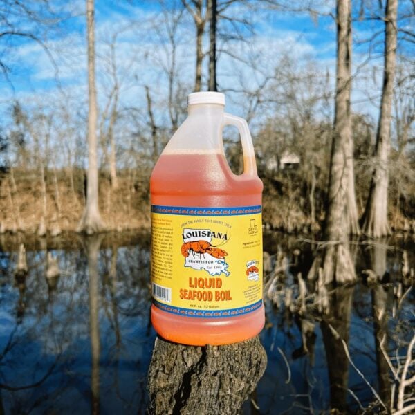 bayou .5 A half-gallon plastic jug of orange LA Crawfish Co. Seafood Boil liquid concentrate.
