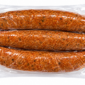 Three links of mild Comeaux’s Pork Boudin in a vacuum-sealed package.
