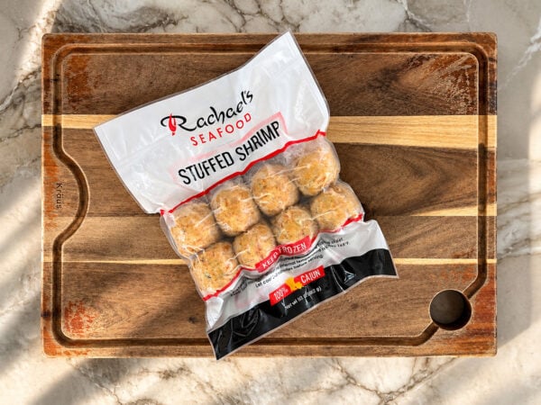 Stuffed-Shrimp A package of Rachael’s Sampler frozen stuffed shrimp resting on a wooden cutting board.