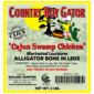 Product label for 5 lb bone-in alligator legs (non-marinated) showing a cartoon alligator cooking by a campfire.