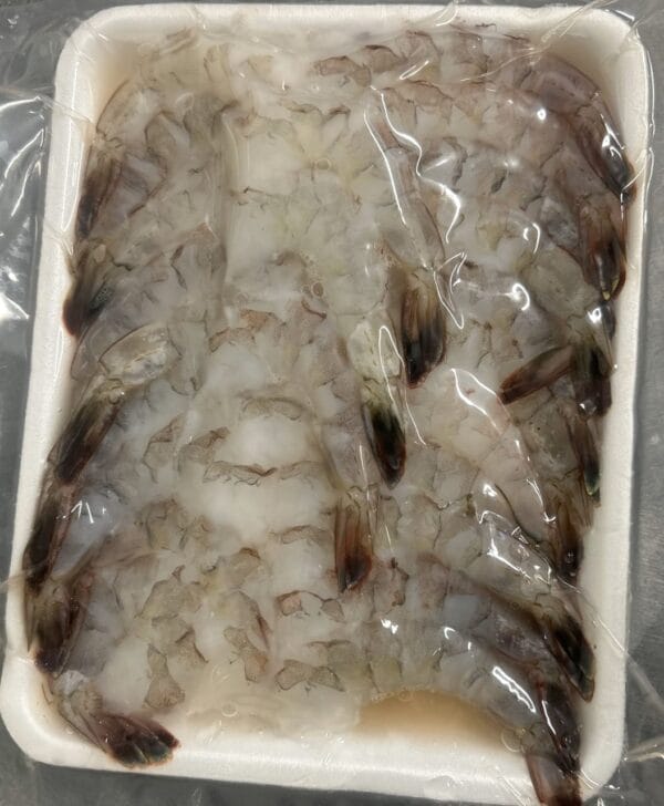 A tray of Anna Marie large peeled, deveined, tail-on shrimp—perfect for authentic Louisiana seafood recipes.