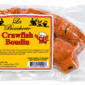 A vacuum-sealed link of La Boucherie Crawfish Boudin featuring a yellow product label.