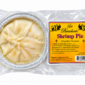 A round La Boucherie shrimp pie in a foil tin, shown beside its yellow product label with cooking instructions.