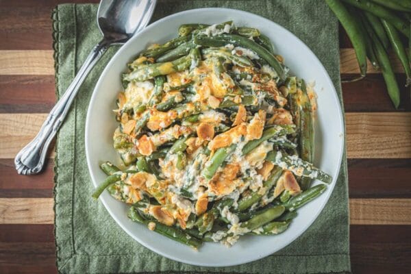 La Boucherie 1 lb Green Bean Casserole Side Dish with cheese and almonds, a great match for Louisiana seafood.