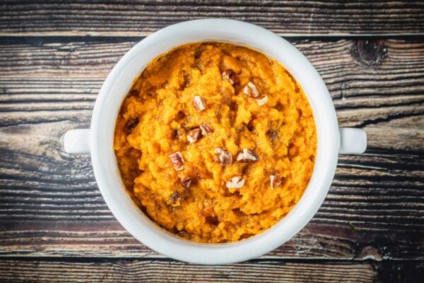 La Boucherie 1 lb Sweet Potato Casserole topped with pecans, perfect as a side for classic Cajun meats.