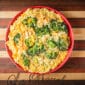 La Boucherie 1 lb Broccoli and Rice Side Dish, ideal with Louisiana seafood or Cajun meats, served in a red bowl.