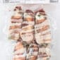 Six bacon-wrapped, cream cheese-stuffed jalapeno poppers, Cajun-style and vacuum-sealed for freshness.