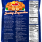 Shrimp and crab boulettes garnished with lemon and parsley, shown on blue product packaging.