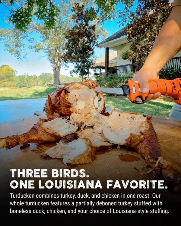 15 lb tuducken cut An electric knife carves a 15 lb LA Crawfish Co. Turducken on an outdoor wooden cutting board.