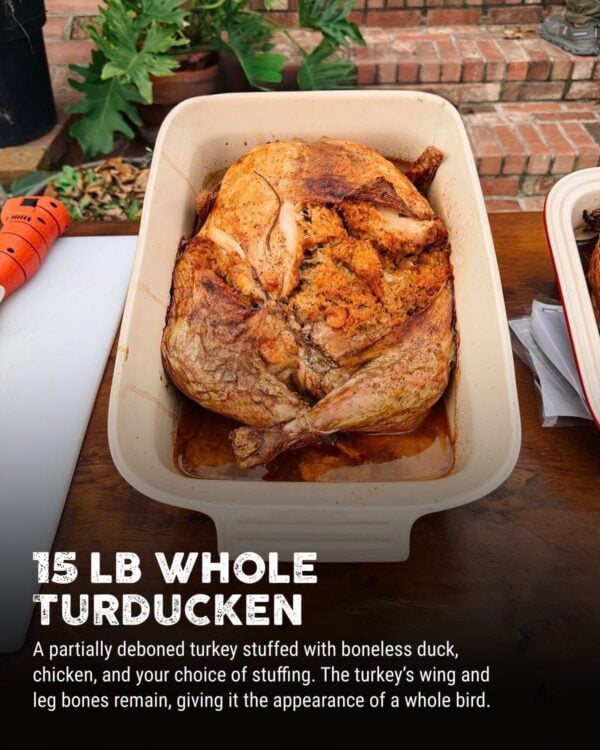 15 lb turducken baked A 15 lb LA Crawfish Co. turducken with stuffing in a ceramic baking dish.