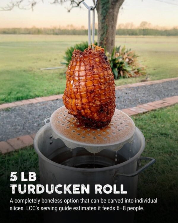 La Crawfish Co 5 lb turducken roll fried A 5 lb LA Crawfish Co. Turducken Roll in netting hangs from a hook over a large metal pot.