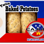 Two Cajun Market Meats shrimp twice-baked potatoes with visible seasonings, packaged in a plastic-windowed box.