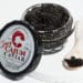 An open jar of “Cajun Caviar - Spicy,” inspired by Louisiana seafood, promises a bold, classic Cajun flavor.