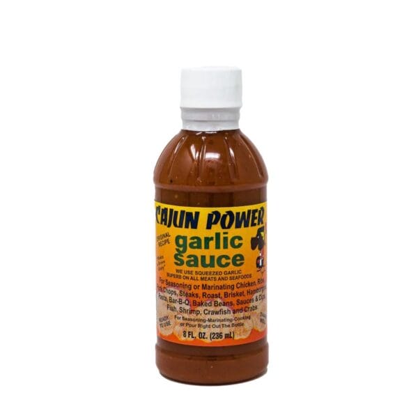 Cajun Power Garlic Sauce, 8 oz, features a white cap and yellow label—perfect for Louisiana seafood or Cajun meats.