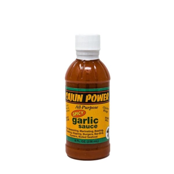 Cajun Power Garlic Sauce bottle with white cap and yellow label, spicy flavor, ideal for meats or seafood.