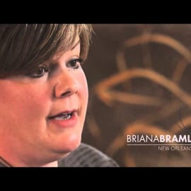 A woman with short hair speaks. On screen: “BRIANA BRAML, New Orleans.” She talks about Louisiana crawfish.