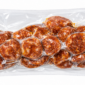 A 12oz vacuum-sealed package of The Best Stop coin-cut smoked pork sausage.
