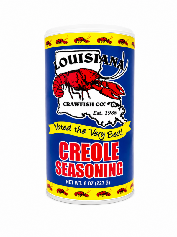 LA Crawfish Co Creole Seasoning packet in a cylindrical container with a red crawfish over a Louisiana map.