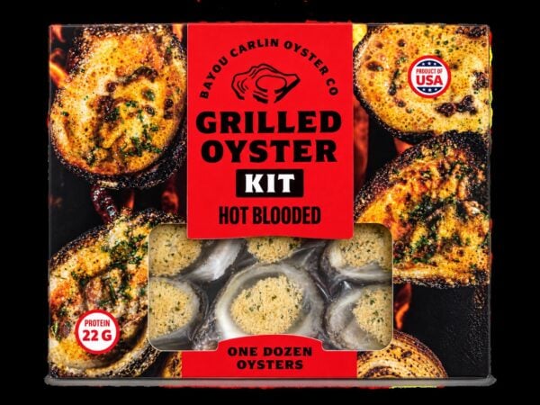 A “Grilled Oyster Kit- Hot Blooded - 1 dozen” box displays appetizing grilled oysters on its colorful packaging.